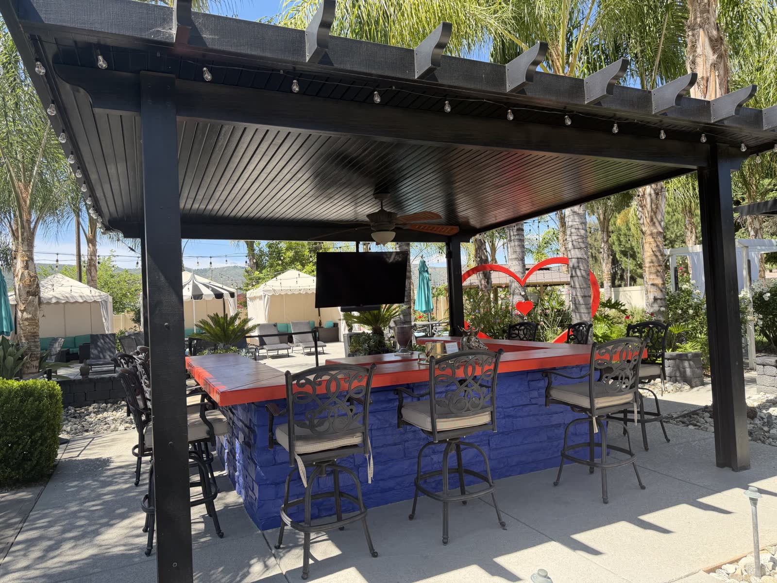 Outdoor cafe bar and lounge seating under the pergola at Murrieta Day Spa